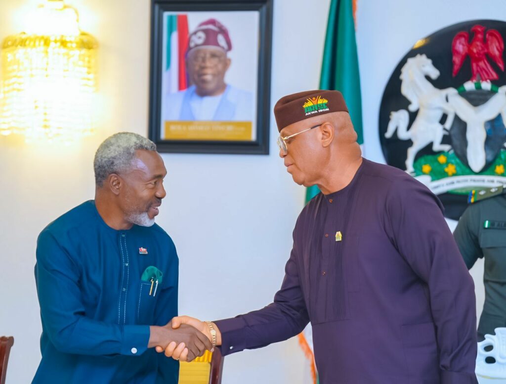 Akwa Ibom governor pastor Umo Eno, National Chairman of NIPR Neliaku in a handshake at Govt House, Uyo