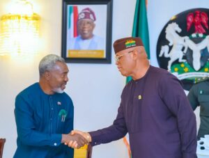 Akwa Ibom governor pastor Umo Eno, National Chairman of NIPR Neliaku in a handshake at Govt House, Uyo