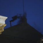 Black smoke billows from the chimney of the Sistine Chapel during the cardinals’ conclave to elect a new pope, at the Vatican, Wednesday, May 7, 2025. (AP Photo/Alessandra Tarantino)
