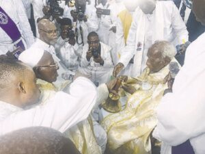Baba Aladura Pro. Alogbo (left), handing paraphernalia of office to Special Apostle Pro. Fabiyi