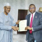 Minister of Housing and Urban Development Architect Ahmed Dangiwa (L) and EFCC Executive Chairman Mr Olanipekun Olukoyede (R)