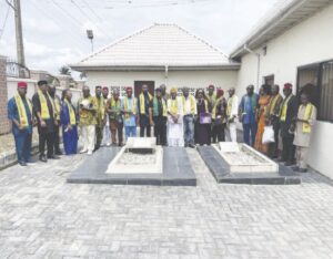 Ikeotuonye Jr, Obi, Obiatuegwe, Augustina Iwuala and other members, at the graveside of Ikeotuonye and wife