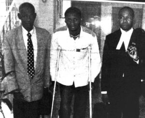 Nwaokporo (middle), his father Nwaokporo (left) and lawyer, Ejiofor, after a court hearing in April 2008