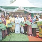 Sulieman-Ibrahim and Nwagba with some of the beneficiaries of the solar power system in Abuja