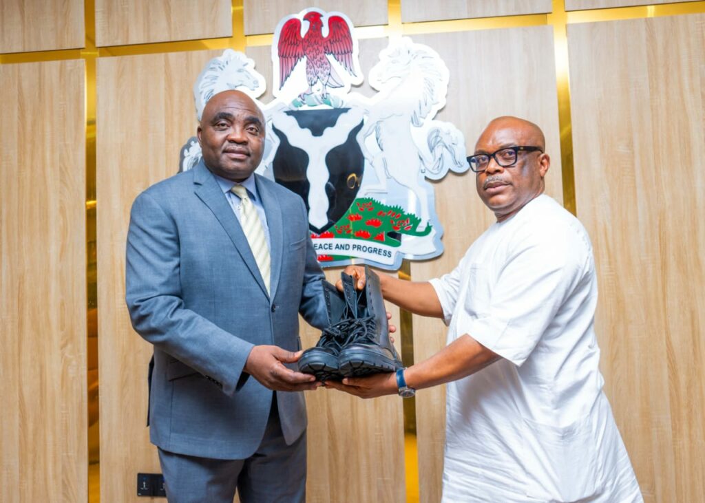 ICRC DG Dr Johnson Ewalefo receiving paramilitary shows from CEO of Erojim Investment Ltd Jimmy Ntue