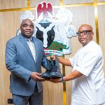 ICRC DG Dr Johnson Ewalefo receiving paramilitary shows from CEO of Erojim Investment Ltd Jimmy Ntue