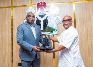 ICRC DG Dr Johnson Ewalefo receiving paramilitary shows from CEO of Erojim Investment Ltd Jimmy Ntue