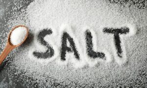 word-salt-made-sea-salt-spoon-black-smokey-background-scaled-1-780×470