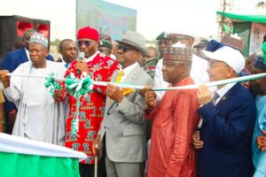 L-R: National Chairman of All Progressive Congress (APC), Abubakar Ganduje, Deputy Speaker of House of Representatives, Benjamin Kalu, Minister of FCT, Nyesome Wike and other dignitaries at the commissioning of the new Collector Road CN2, popularly known as Zakari A. Kiari Street, Abuja