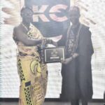 Bobo Zion (right) receiving the award.