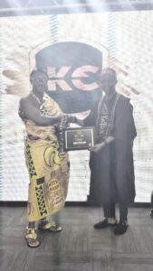 Bobo Zion (right) receiving the award.