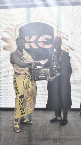 Bobo Zion (right) receiving the award.