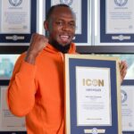 Usain Bolt with Guinness World Records Icon certificate