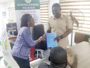 Former DG, Professor Olawale Moronkola ably represented by Omonode .T. Christyne, Head of Department of Coaching and Training (L) handing over to the new DG, Comrade Philip Shaibu