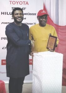 Kunle Ade-Ojo (right), Managing Director, Toyota Nigeria Limited, presenting the award to Chino Ogwumike, National Sales Manager, Kojo Motors Limited