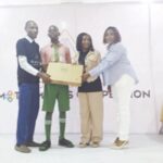 L-R- Dr Olukayode, Debbie and Toyin presenting a laptop to Oluwafareanmi