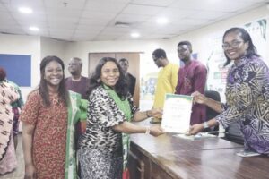 Mrs Umeha receiving her induction certificate