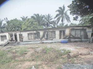 One of the burnt houses in Lilu community (Inset- Wreckage of the burnt palace at Lilu)