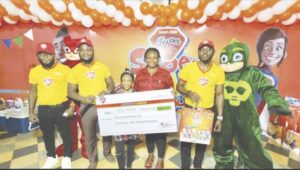 Staffs and a winner at the event.