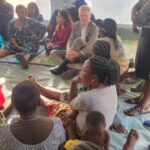 The European Union Ambassador to Nigeria, Gautier Mignot, and other officials addressing and listening to victims during a chat at IDP camp in Makurdi