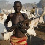 Armed herder