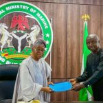 Oyetola with the President National Fishers Cooperative of Nigeria Mr. Mashi Gabriel Sani during the meeting in Abuja