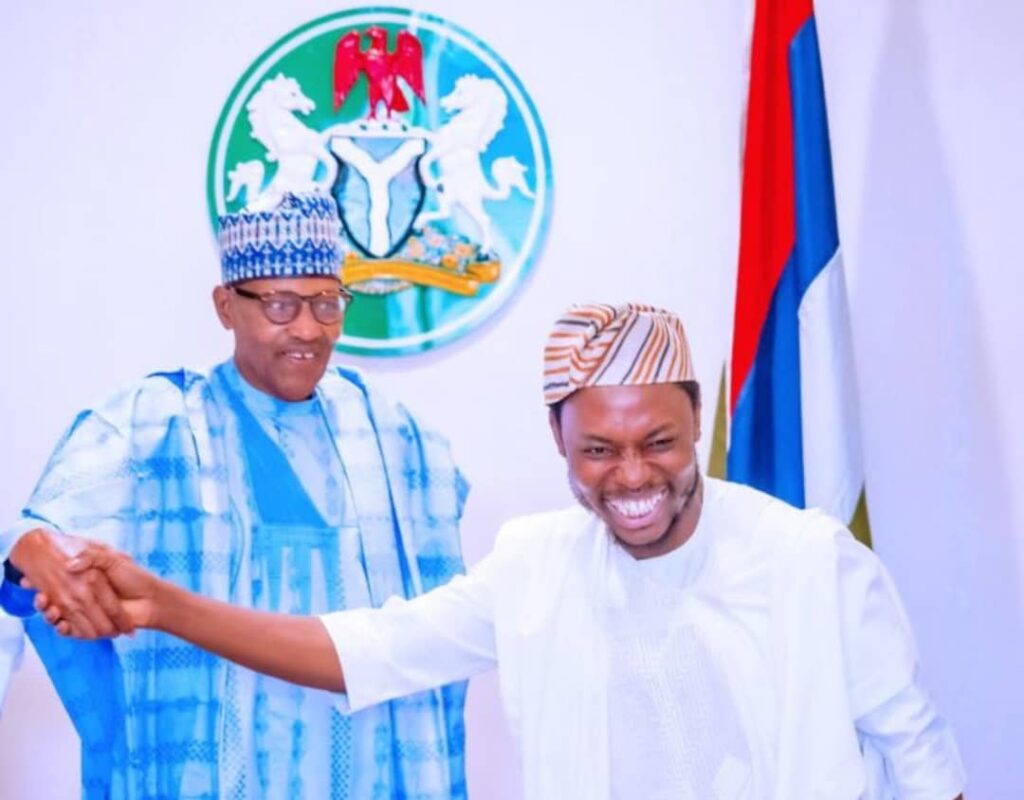 President Muhammadu Buhari and photographer Bayo Omoboriowo