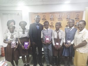 Dr. Olatunbosun and Mrs. Ego pose with winners of the competition