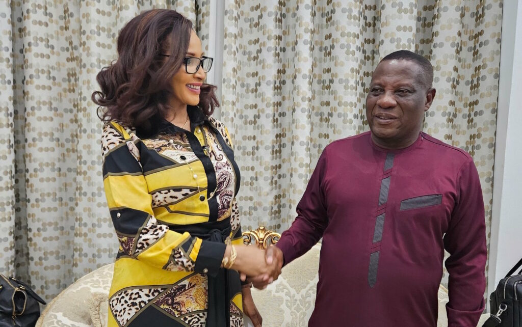 Nigeria’s Minister of State for Foreign Affairs Bianca Odumegwu-Ojukwu shakes hands with Christian Tetteh Yohuno, Ghana’s Inspector General of Police