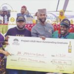 One of the beneficiaries receiving his award from organisers of the programme