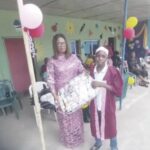 Onyemaizu receiving gift from Nwakobi