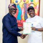 Commissioner for Insurance Mr Ayo Omosehin (left) at the handover ceremony