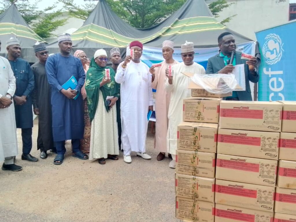 Borno State Commissioner of Health, Prof Baba Mallam Gana (middle) and UNICEF officials during the handing over of 2,254 cartons of Ready-to-Use Therapeutic Food in Maiduguri on Wednesday, July 16