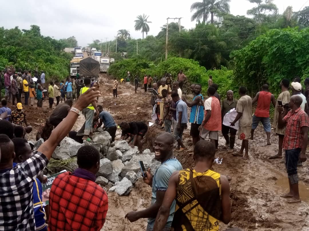 Transporters filling the bad portions on Ijan-Ilumoba road with the trucks of hardcore stones provided by Emmanuel Fayose