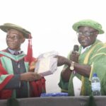 • Ezeh being presented with an award by DVC Usman