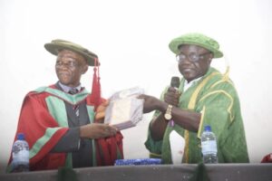 • Ezeh being presented with an award by DVC Usman