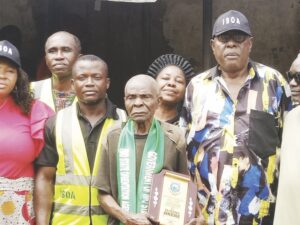 •Pa Okere and staff of ISOA