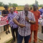 Chairman of ASUU, TASUED branch, Dr Wale Ositoye, addressing members during a peaceful protest on the university campus