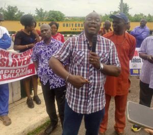 Chairman of ASUU, TASUED branch, Dr Wale Ositoye, addressing members during a peaceful protest on the university campus