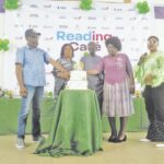 L-R- Familoni, Mrs Eke, Nurayn and others cutting the anniversary cake