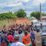 Lawal with residents