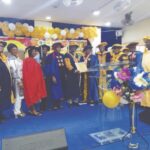 Prof. Ugah receiving his certicate, while others watch