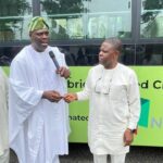 Transport Mandate Secretary Chinedu Elechi receiving the key to one of the hybrid buses from Programme Director and Chief Executive of the Presidential CNG Initiative and donor of the buses, Michael Oluwagbemi, on Thursday, August 14, 2025