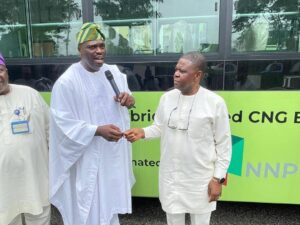 Transport Mandate Secretary Chinedu Elechi receiving the key to one of the hybrid buses from Programme Director and Chief Executive of the Presidential CNG Initiative and donor of the buses, Michael Oluwagbemi, on Thursday, August 14, 2025
