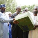 Chief of Staff to the Minister of FCT, Chidi Amadi, who represented him, handing over the subsidised items at the official launch and sale of multiple types of fertilisers to farmers in all six Area Councils