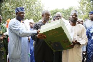 Chief of Staff to the Minister of FCT, Chidi Amadi, who represented him, handing over the subsidised items at the official launch and sale of multiple types of fertilisers to farmers in all six Area Councils