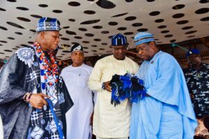 The SGF, Sen. George Akume receiving a gift of the Igede traditional cloth at the Igede Agba Festival.