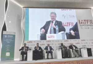 Managing director of Stellantis Sub-Sahara Africa, Mr. Mike Whitfield (on the giant screen), and other discussants at the IATF 2025