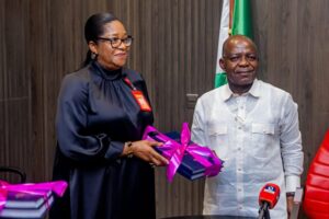 Hon Justice Florence Duroha-Igwe (retd) presenting sealed report to Abia Governor Alex Otti