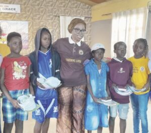 • President of Goldcrest Family Centre ( GCFC) Reverend Agatha Chukwura flanked by winners of the various competitions at the event